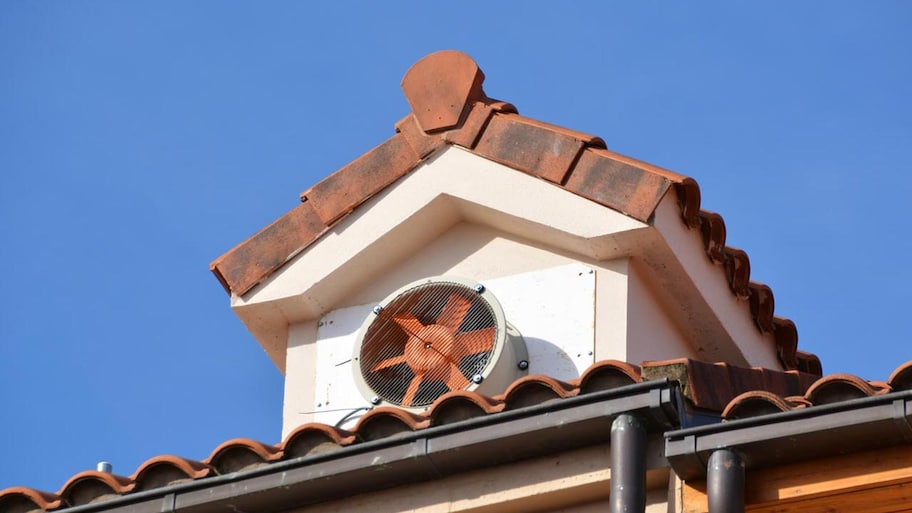 An attic fan as seen from the exterior of the house