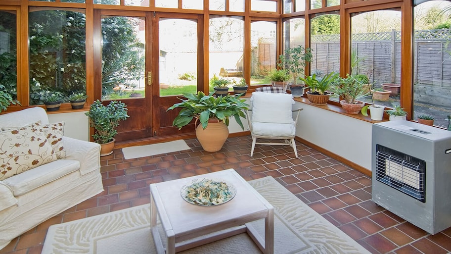 a newly built garden room with a wall of windows