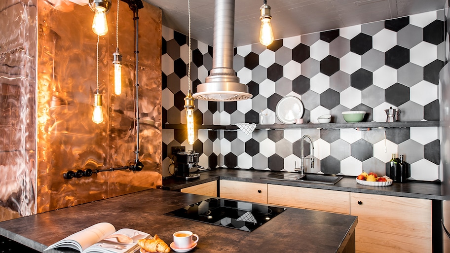 A kitchen with copper wall and countertop