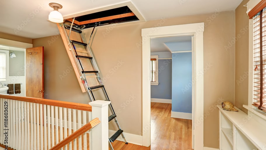 House hallway with a folding attic ladder