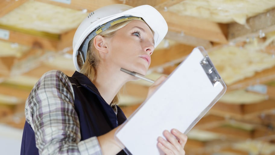 building inspector inspecting home