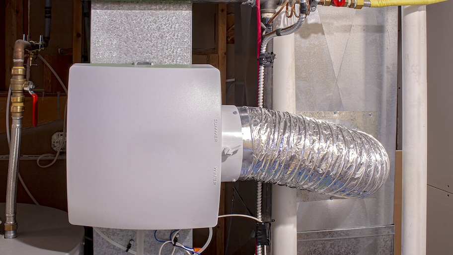 home humidifier installed in ductwork in home