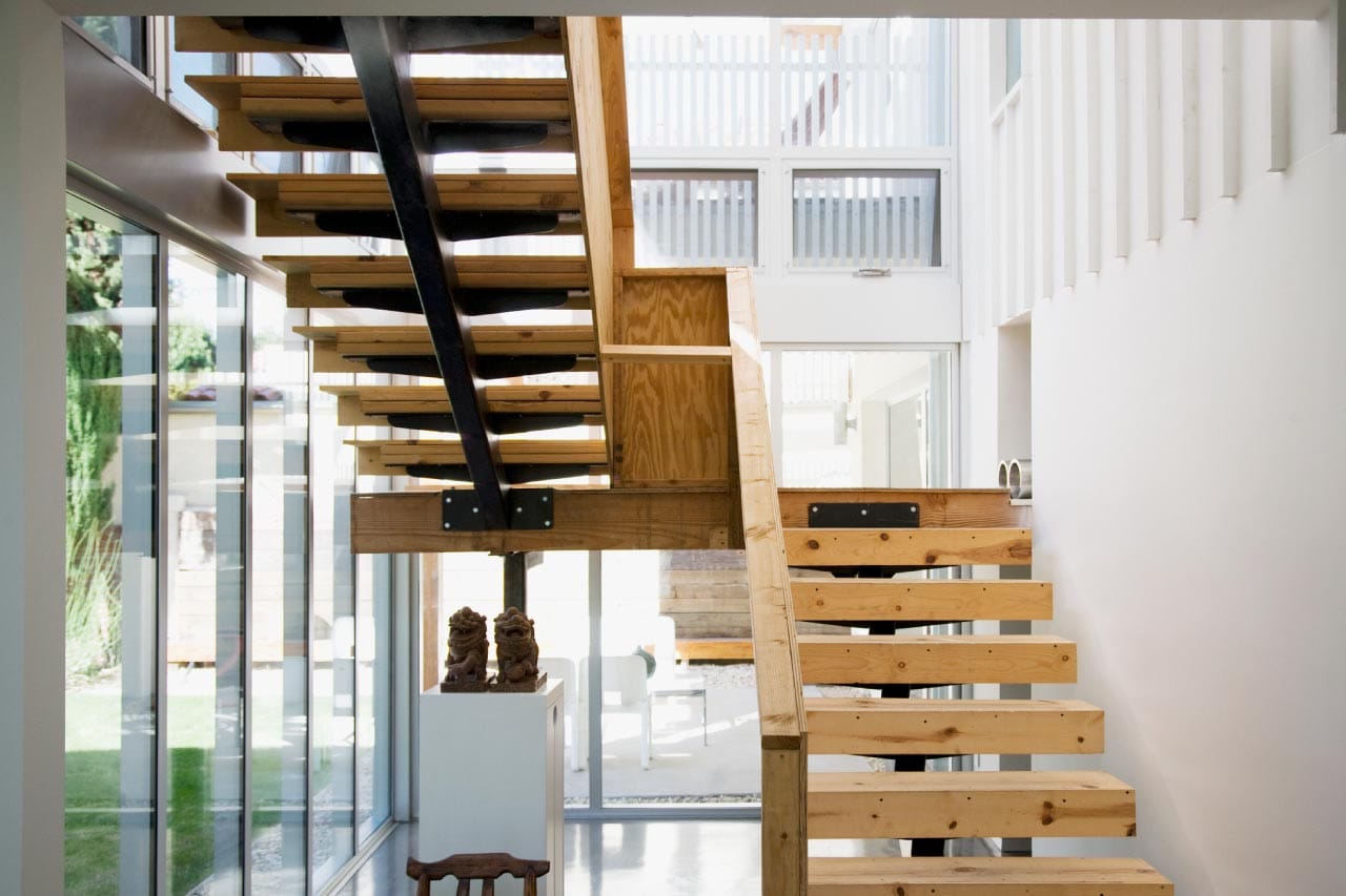 Interior of modern house with wooden stairway