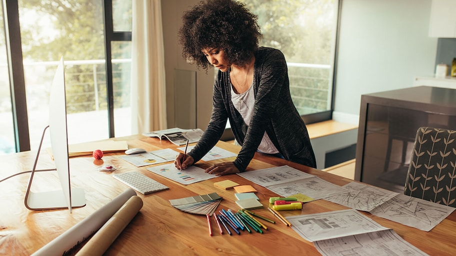 interior designer in office working on home plan project