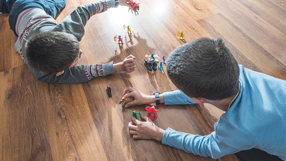 Kids playing with toys on floor