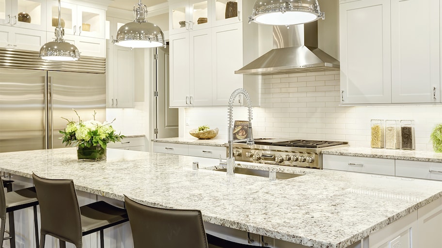 clean white kitchen with granite countertop