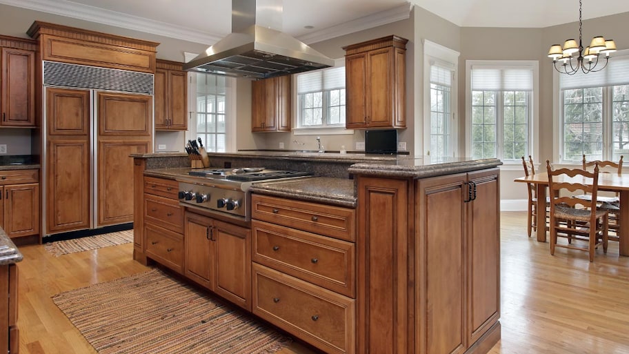 A kitchen with wood cabinets 