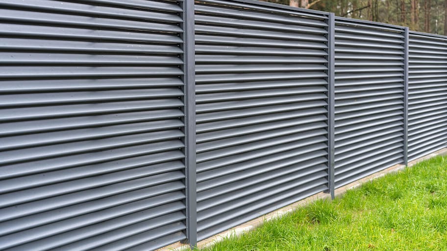 tall metal privacy fence around property