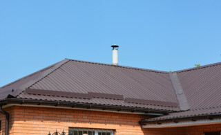 metal roof on brick house