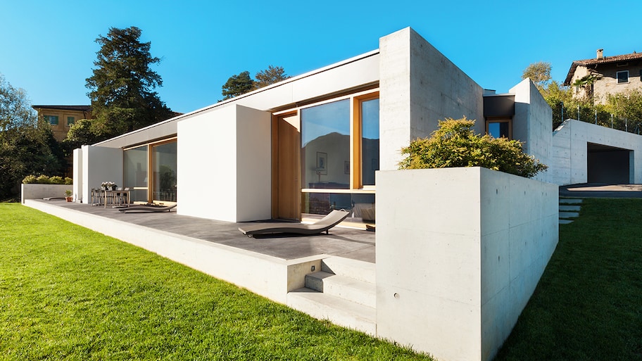 modern cement house with lawn