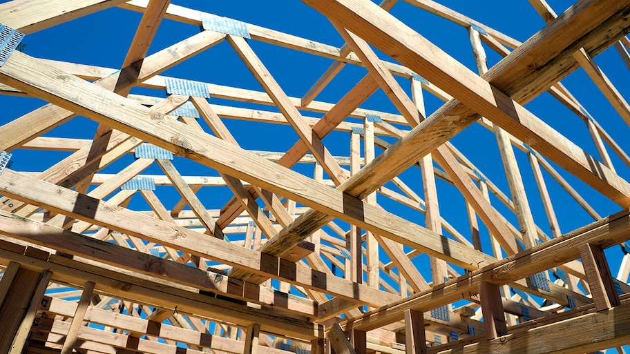 newly built roof framed with wooden trusses