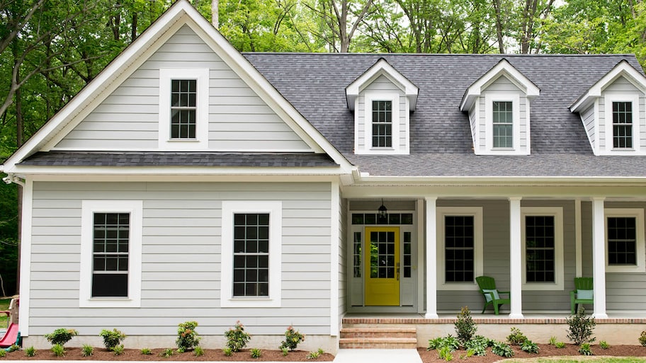 Exterior of newly built suburban house with trees