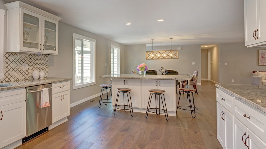 An open space kitchen with engineered hardwood floor