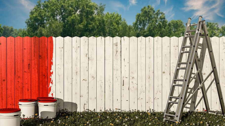 wooden fencing being painted