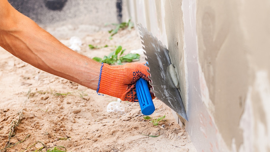 professional repairing the foundation of a home