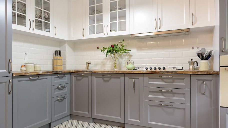 modern kitchen remodeled with new white and gray cabinet doors