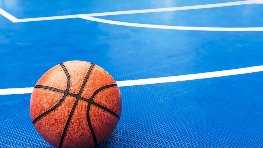 indoor court with new rubber flooring and basketball