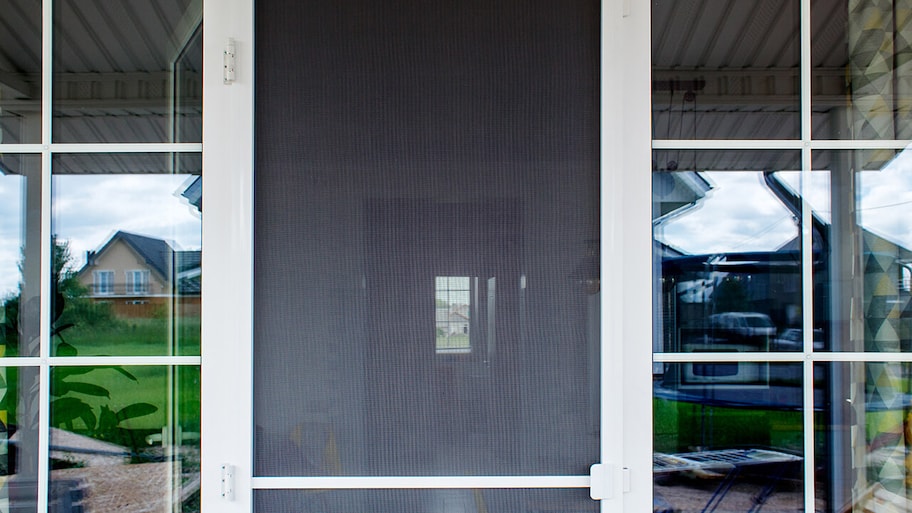 newly installed screen door on home entrance