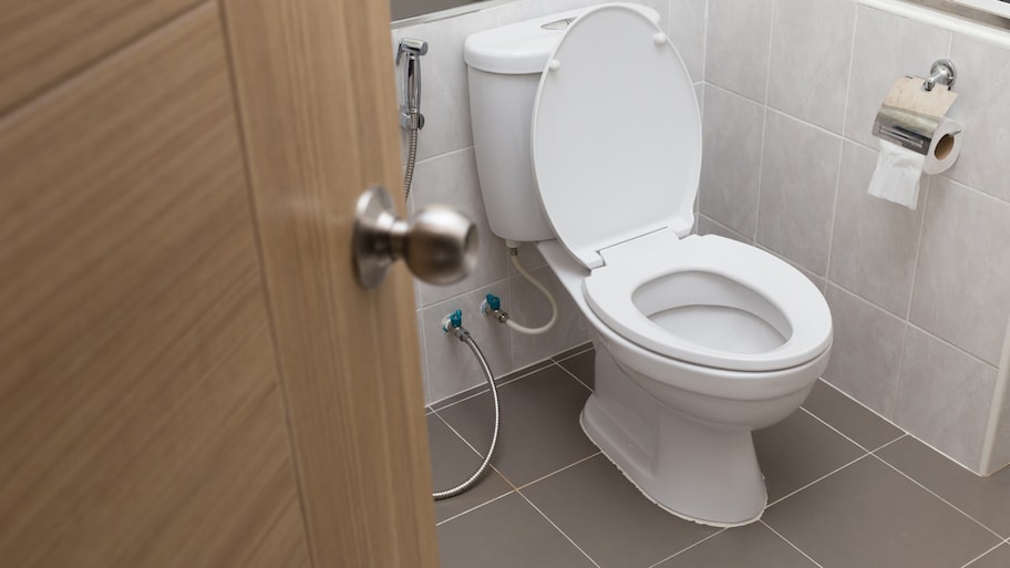 new toilet installed inside bathroom remodel