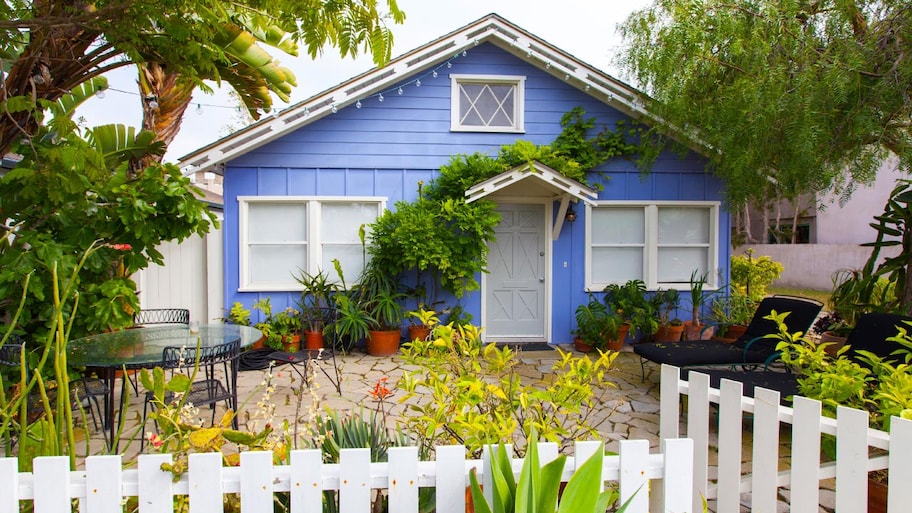 small bungalow with light blue siding 