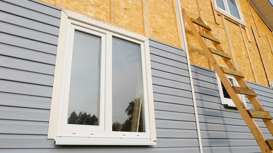 vinyl siding being replaced on exterior of a house