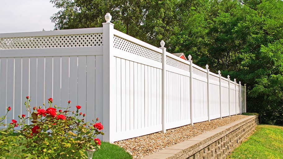 white vinyl fence in backyard