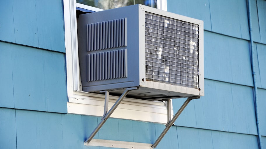 window of home with a window unit air conditioner installed