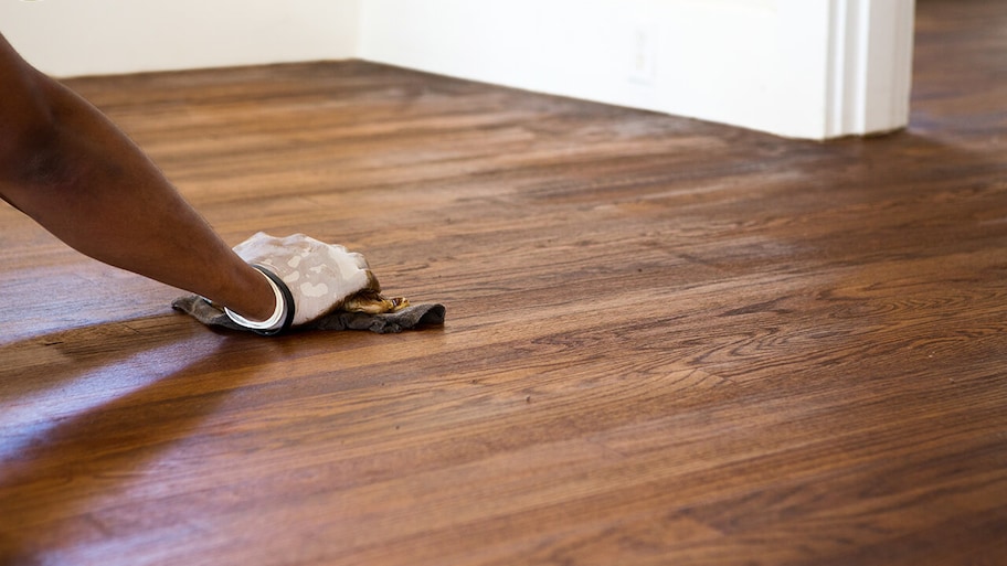 professional refinishing wood floor in home