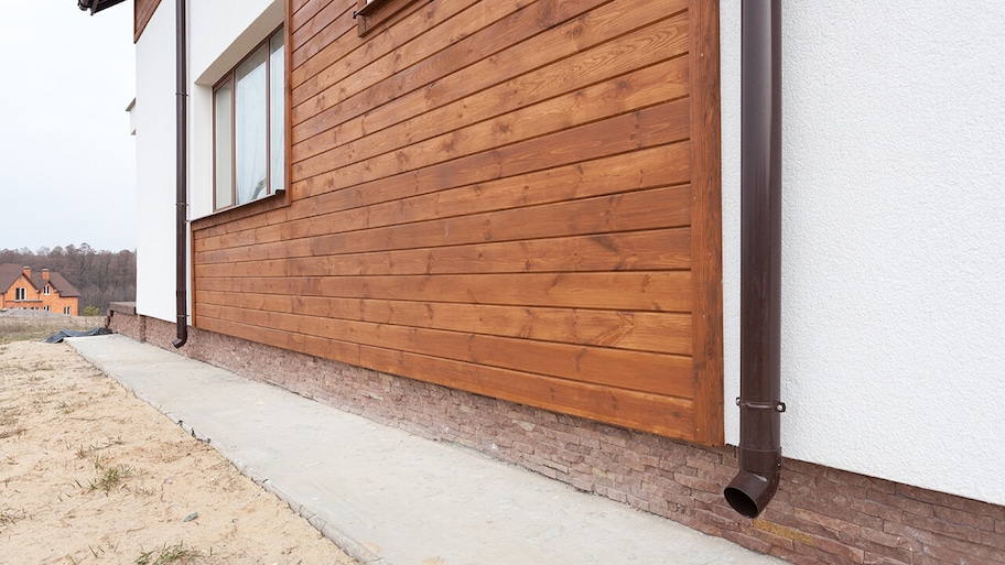 new home construction with wood siding installed